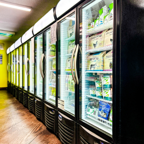 Pet food and supplies inside of the fridges at ShakaPaw.